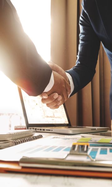 stock-photo-two-confident-business-man-shaking-hands-during-a-meeting-in-the-office-success-dealing-greeting-701613649